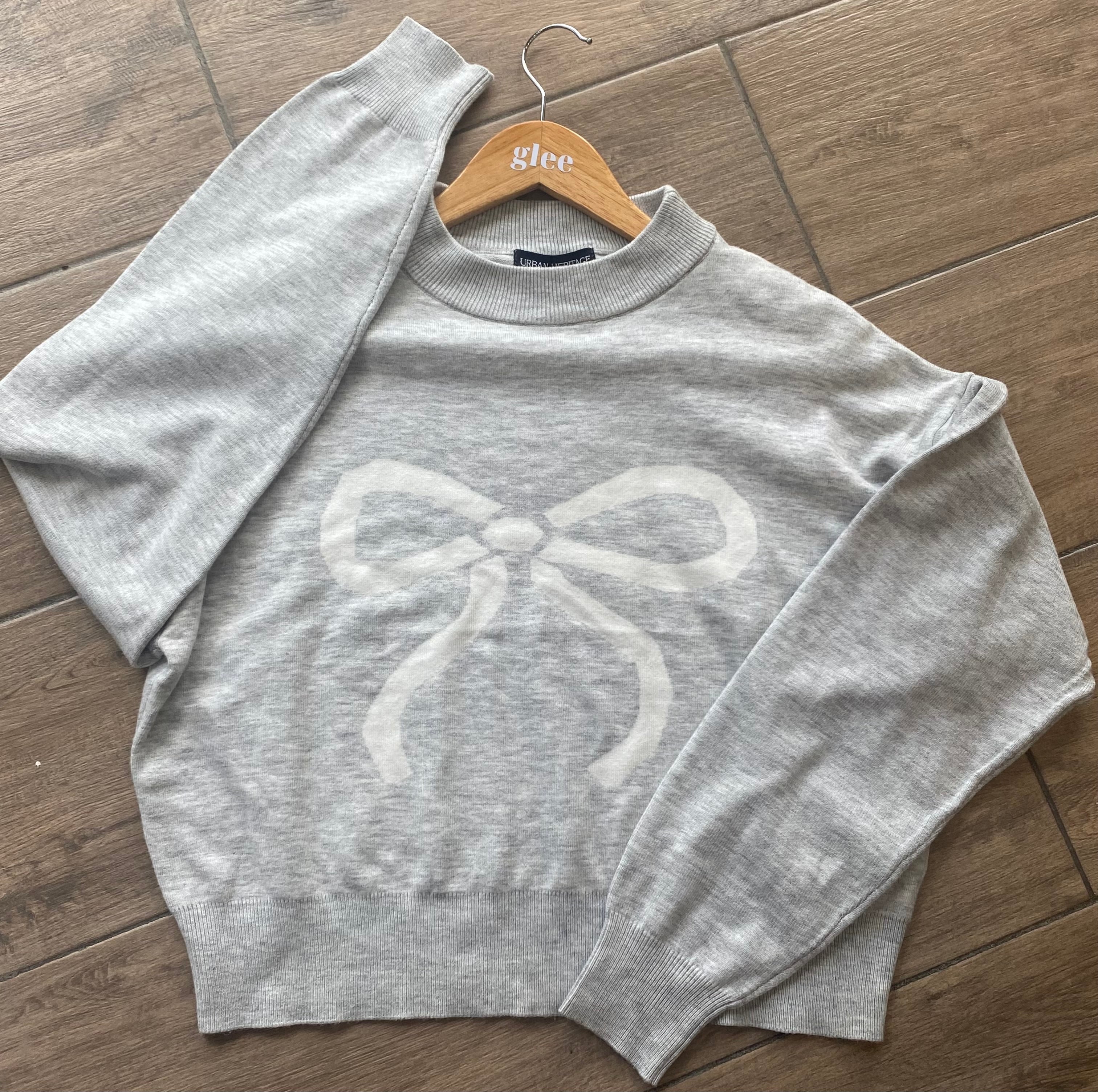 Cardigan con moño coquette J25RY04
