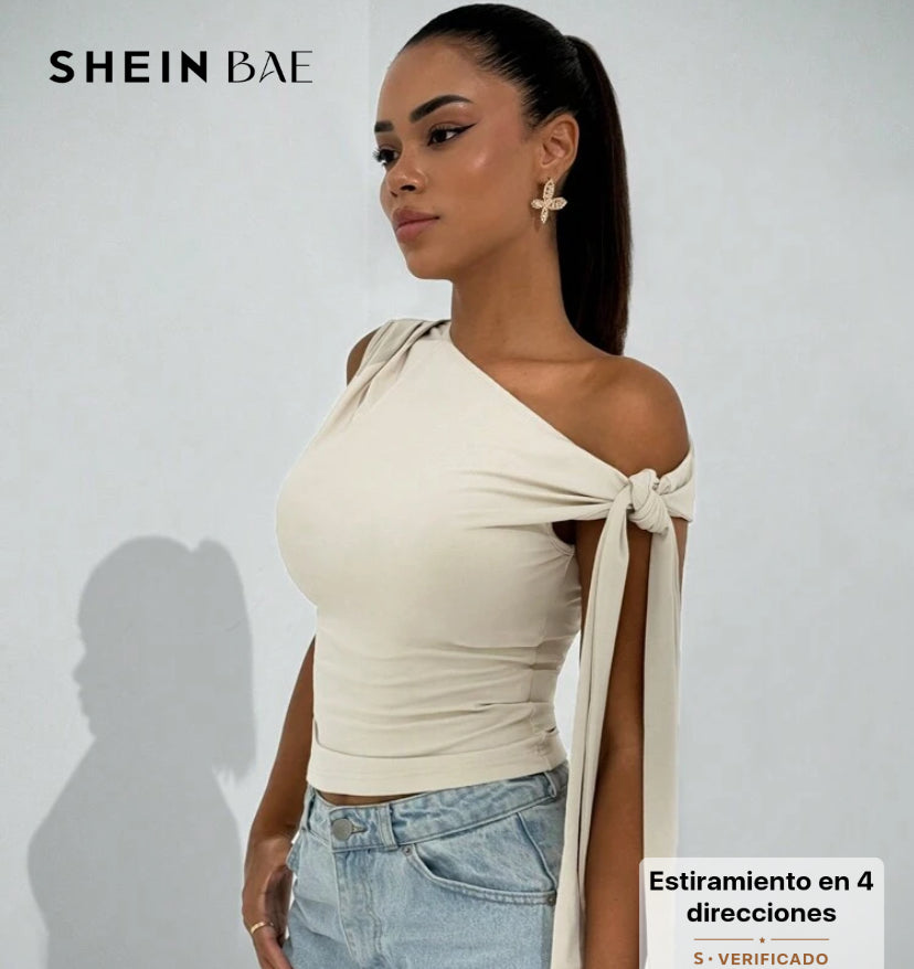 Blusa asimetrica con lazo en el hombro AG25TR04