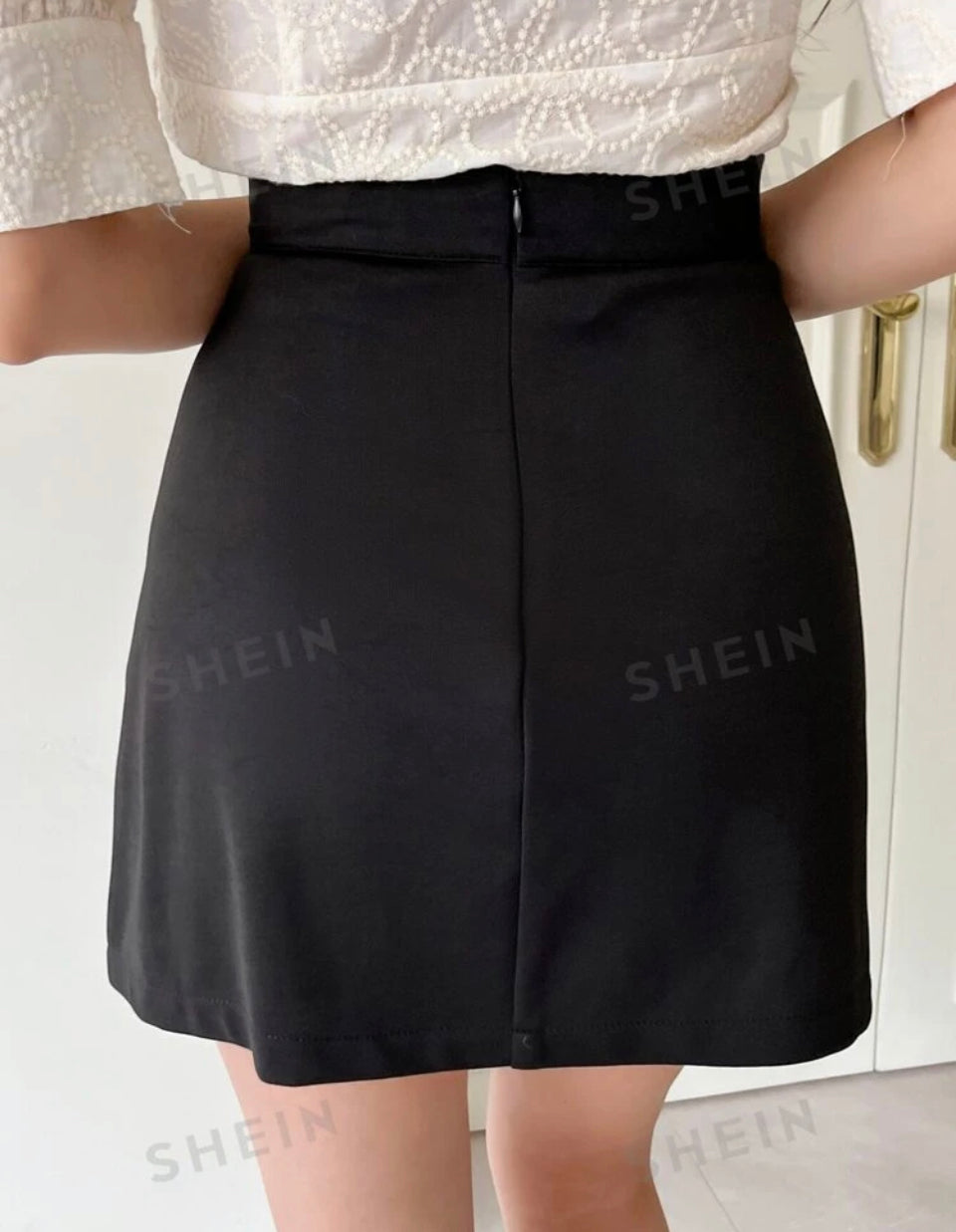 Falda de cintura alta con dobladillo asimétrico M25KP06