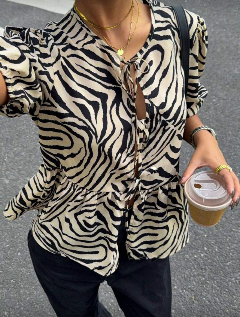 Blusa con estampado de cebra E26XL010