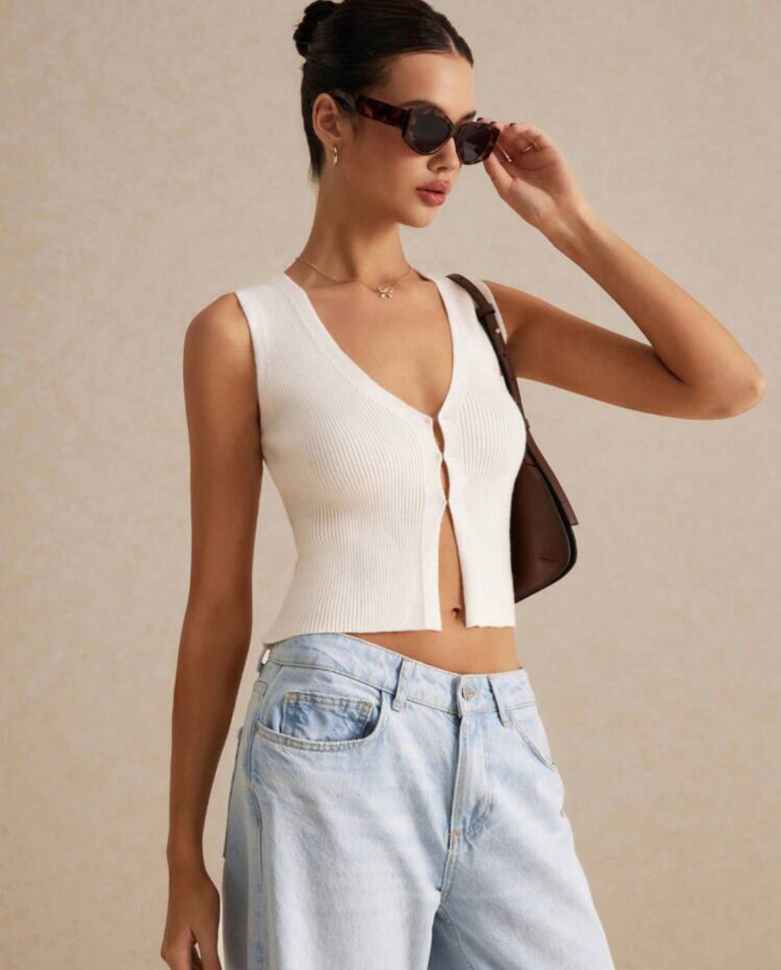 Blusa sin mangas de punto de color liso casual beis A25QH02