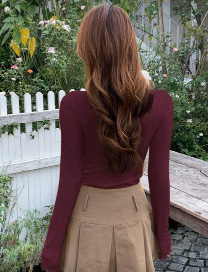 Blusa de cuello alto de manga larga D25WV010