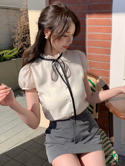 Blusa de mangas abullonadas