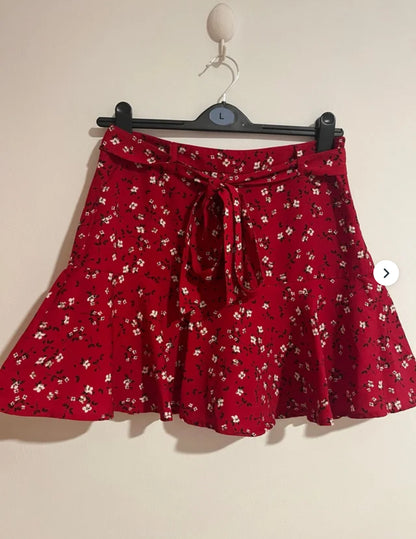 Color Rush Falda plisada con estampado floral. J25RU02