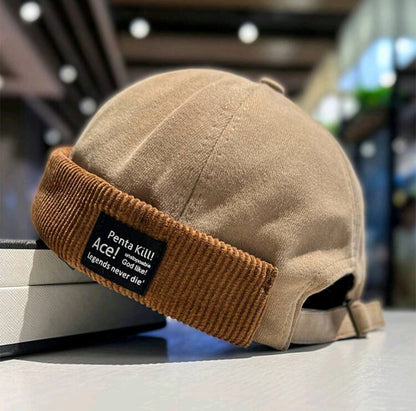 Gorra de estibador con parche de letra y rebite de cordón